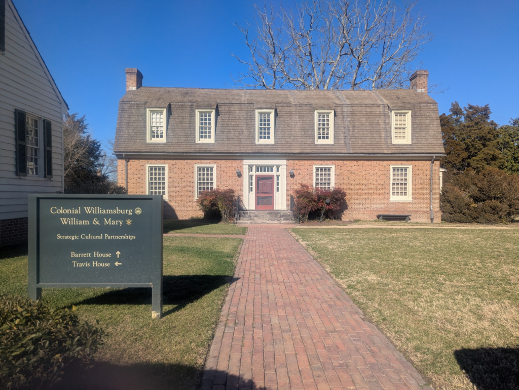 Photo of a large, colonial-era,  two-story brick building.
